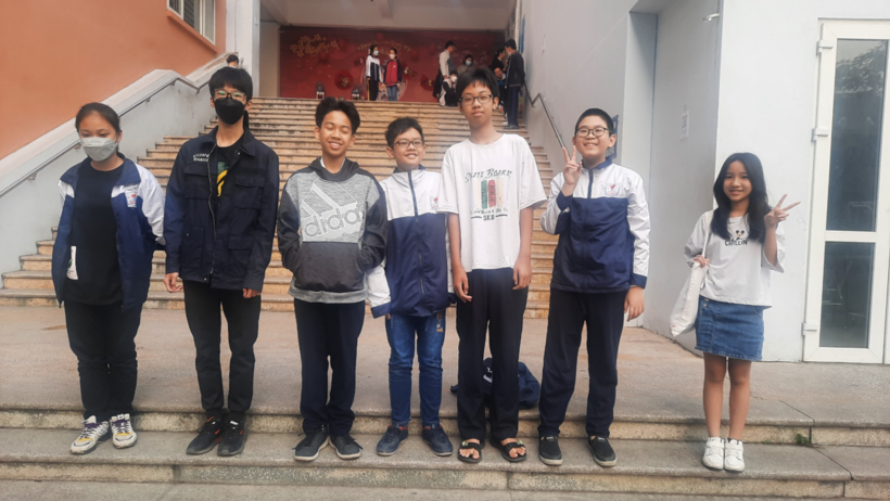 A group of people posing for a photo
Description automatically generated with medium confidence