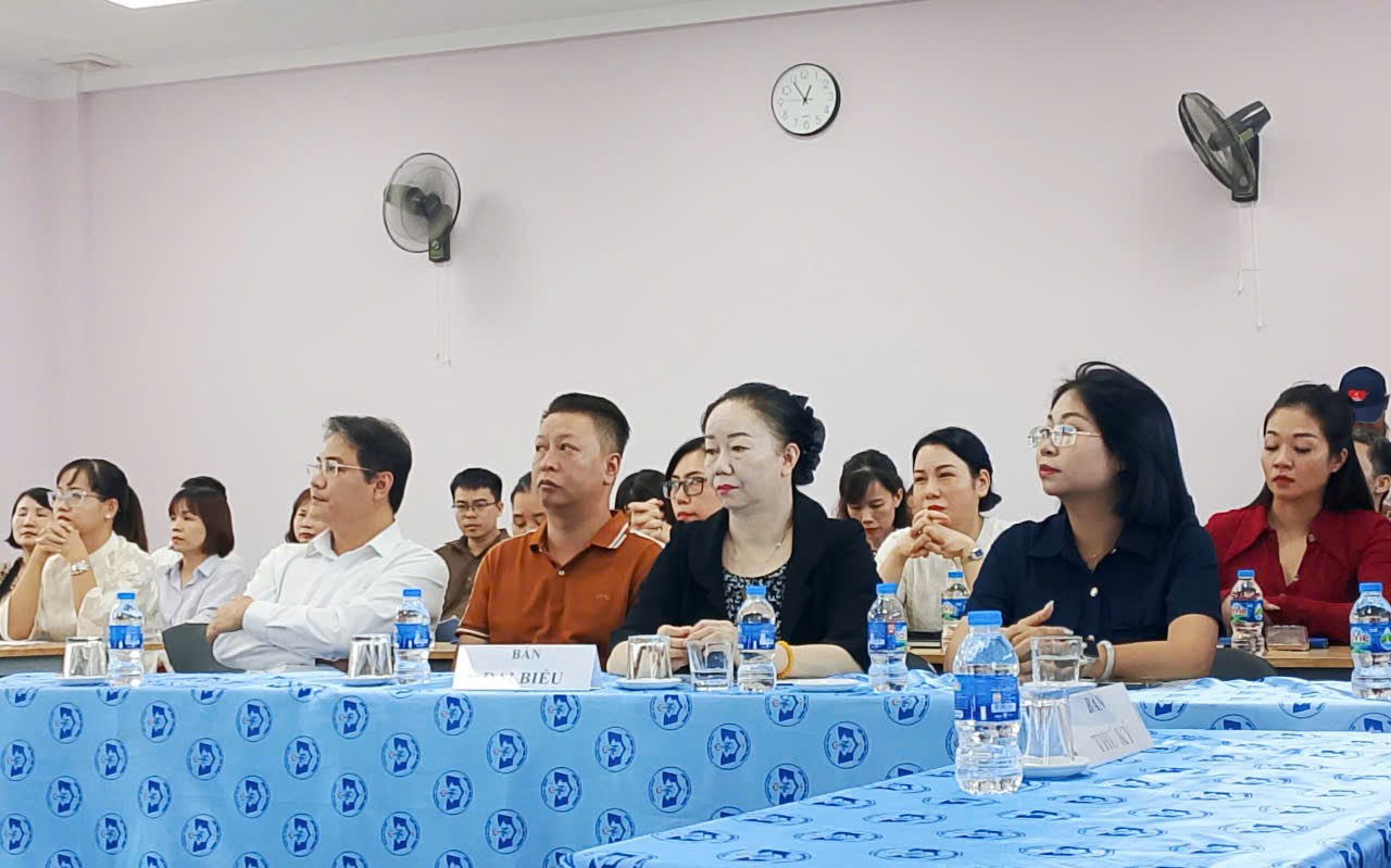 A group of people sitting at a table

Description automatically generated