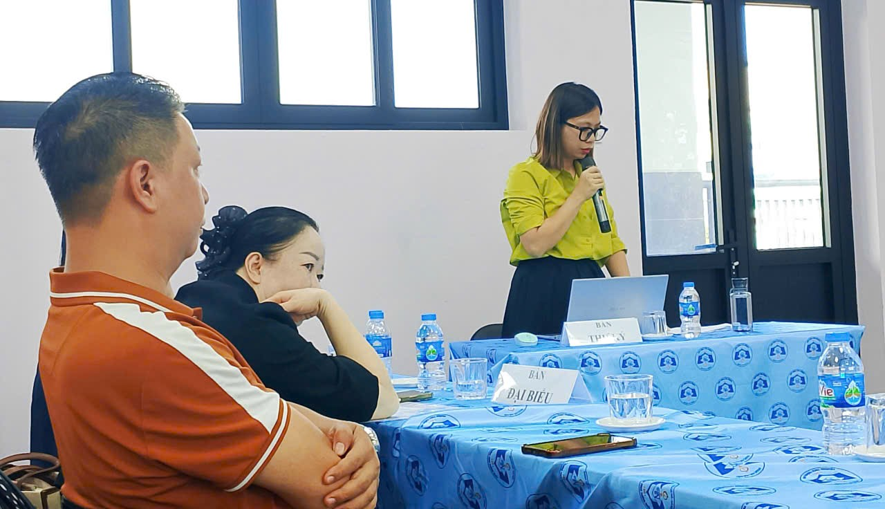 A group of people sitting at a table

Description automatically generated