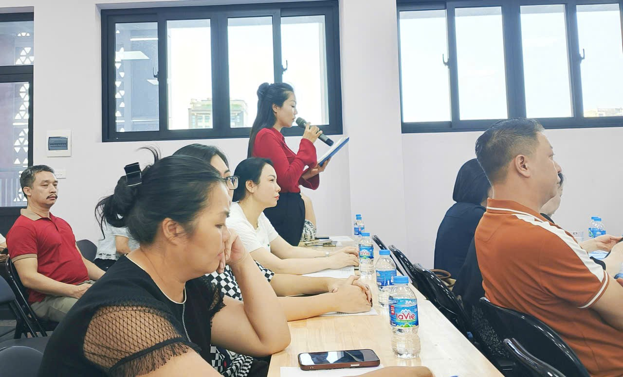 A group of people sitting at a table

Description automatically generated