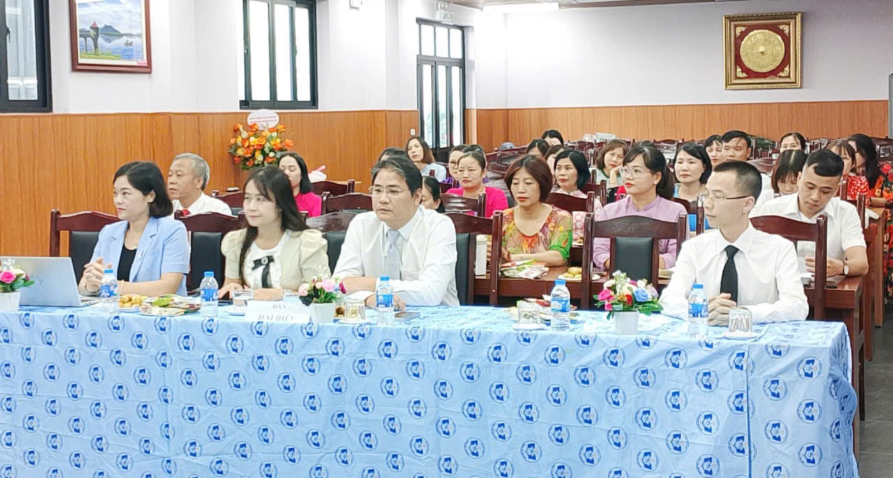 A group of people sitting at a table

Description automatically generated