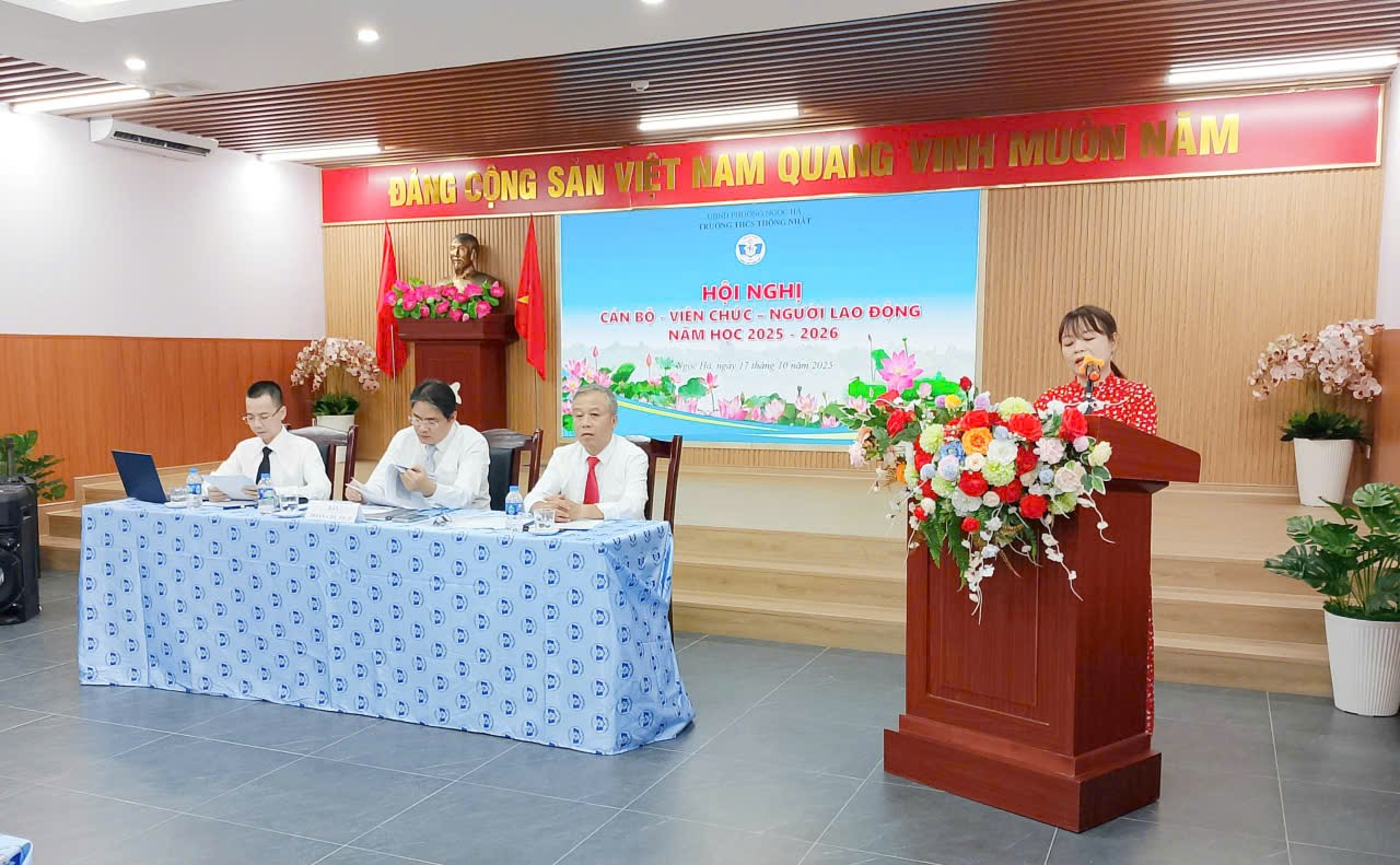 A group of people sitting at a podium

Description automatically generated