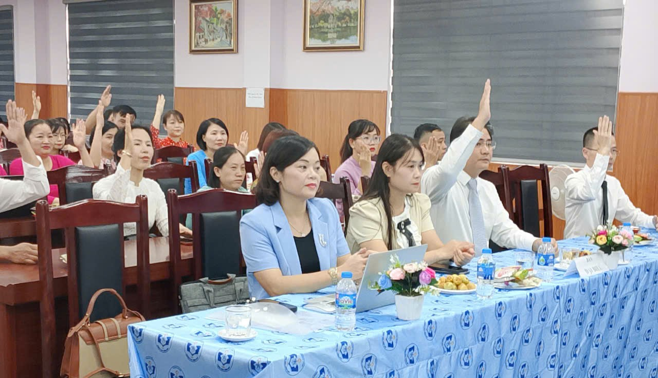 A group of people sitting at a table

Description automatically generated