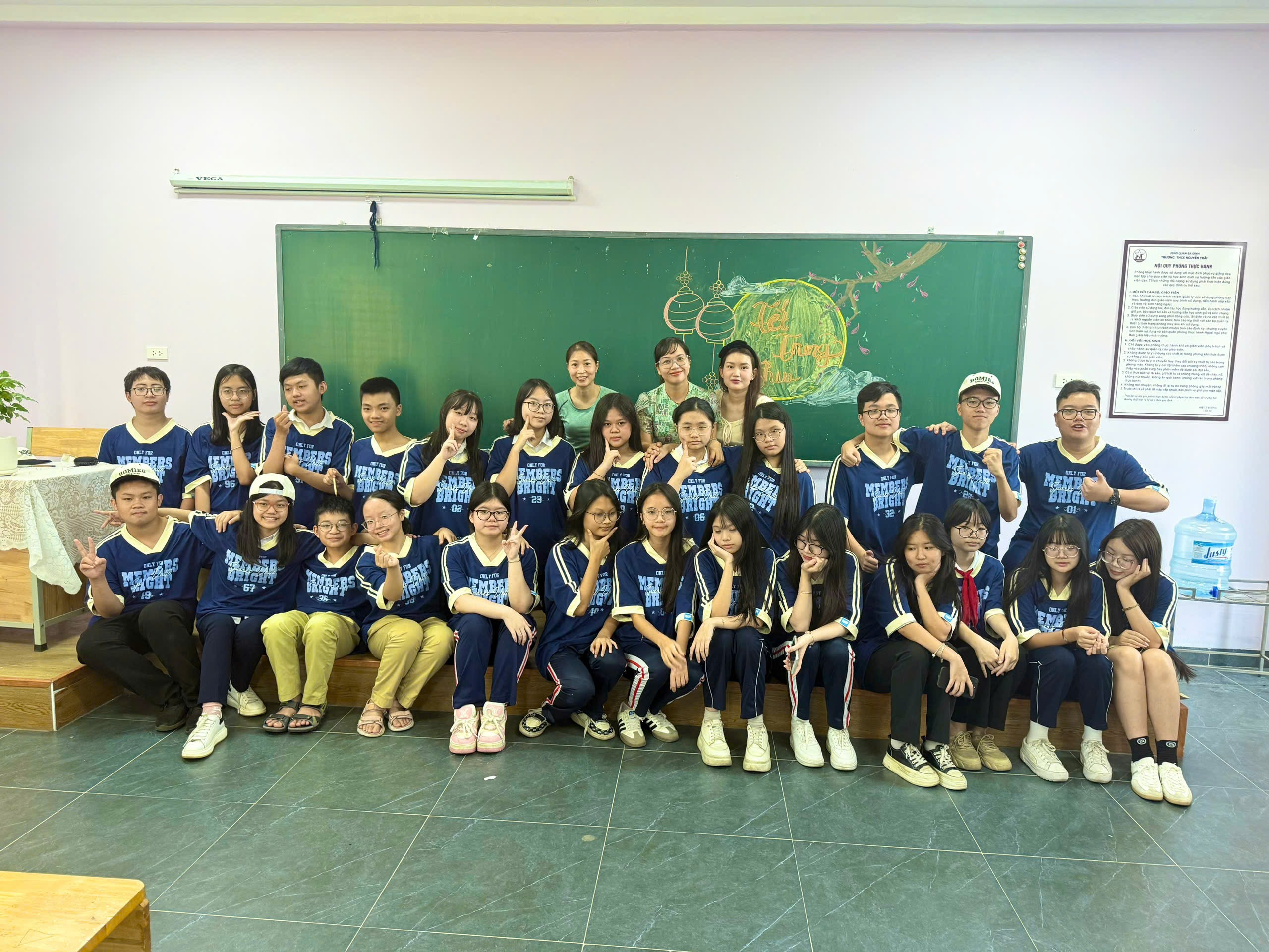 A group of people posing for a photo

Description automatically generated