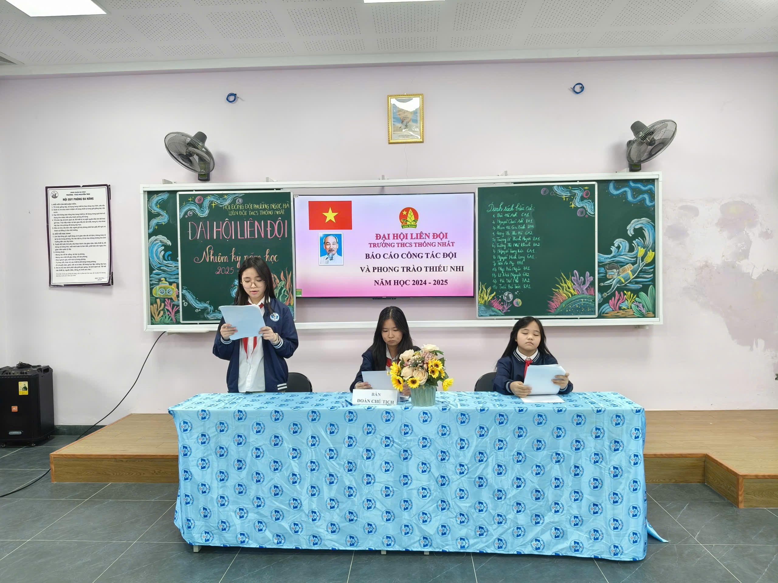 A group of girls sitting at a table

Description automatically generated