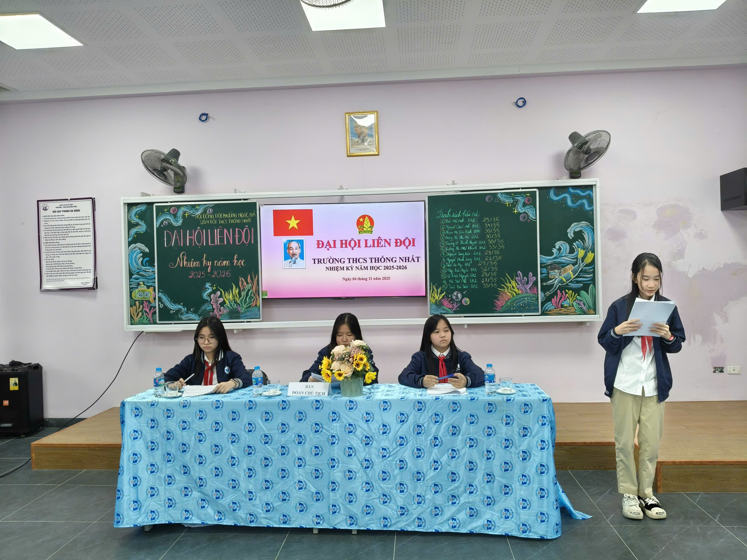 A group of people sitting at a table

Description automatically generated