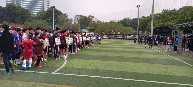 A group of people on a field

Description automatically generated with medium confidence