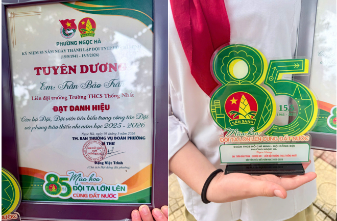 A person holding a plaque

Description automatically generated